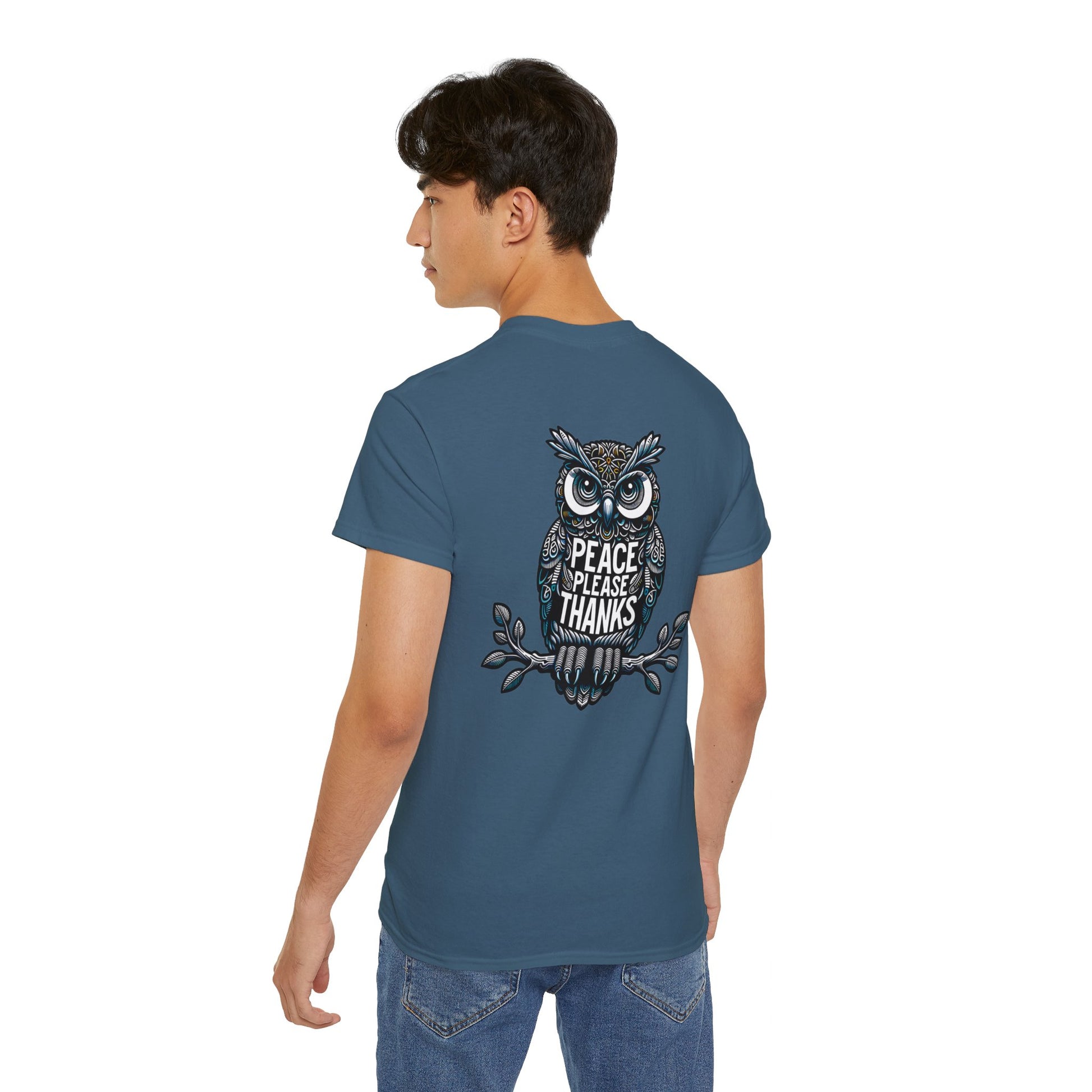 male model with indigo blue Unisex T-shirt Reflective owl illustration with 'Peace Please Thanks' message, showcasing intricate linework and subtle color highlights